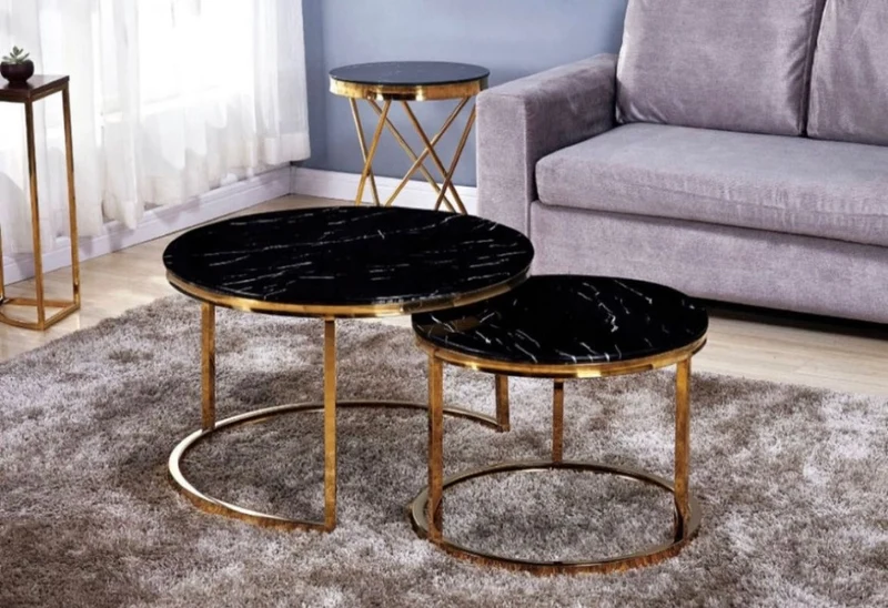 Table Ushuaia marbre noir pieds or