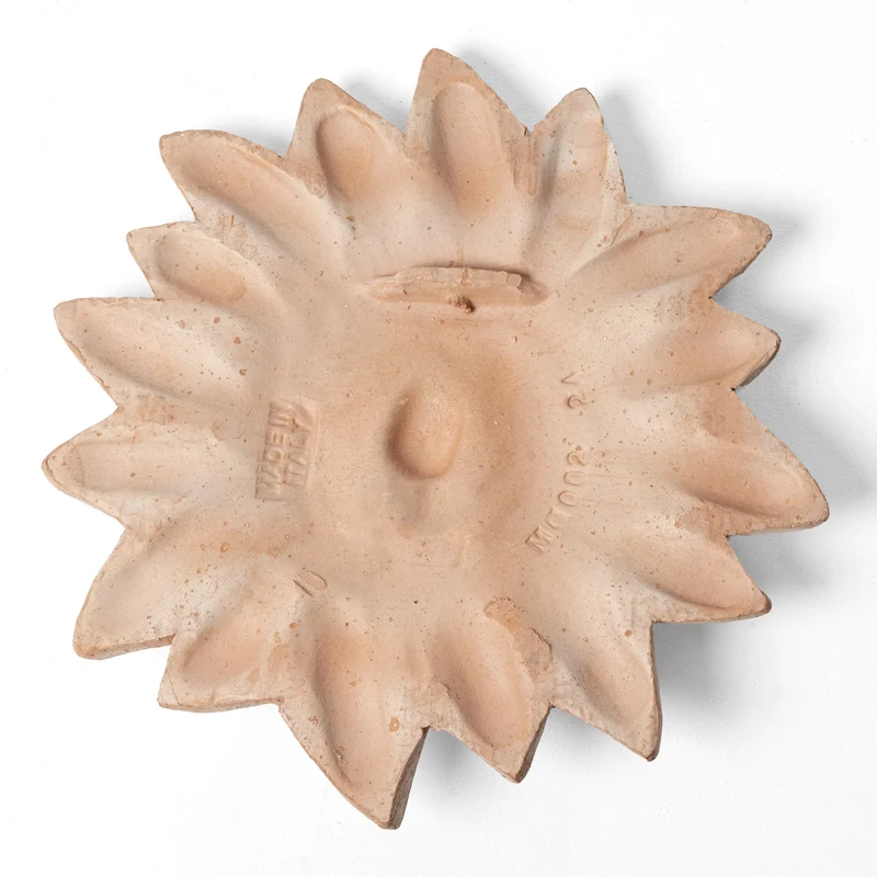 Bas-relief soleil italien en terre cuite