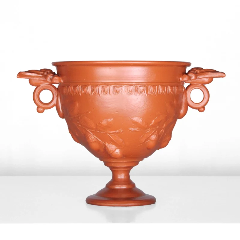 Tasse à vin romain avec reliefs de glands et manche - céramique sigillée