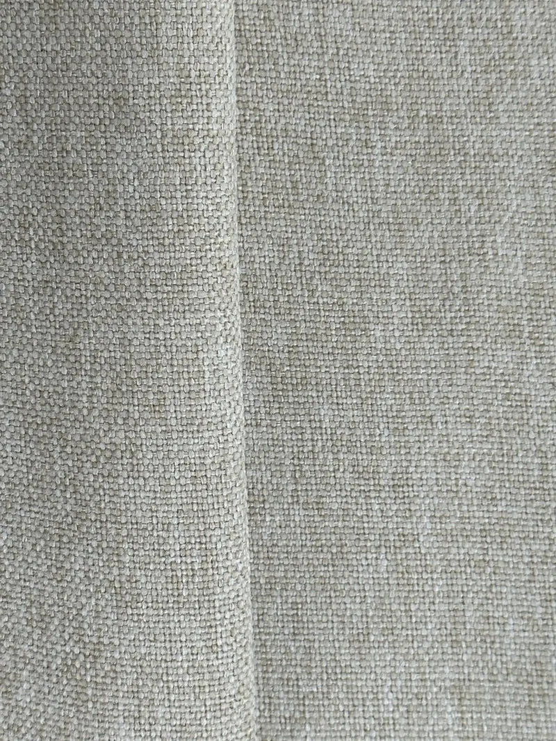 Fauteuil design tissu beige Pablo