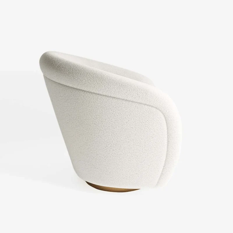 Fauteuil effet laine bouclée et laiton